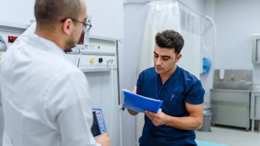 Man receiving a wellness lab report from his doctor