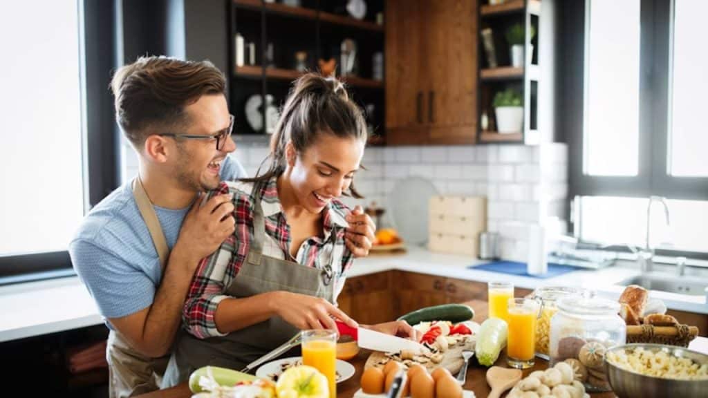 Man complimenting his partner while cooking or during downtime