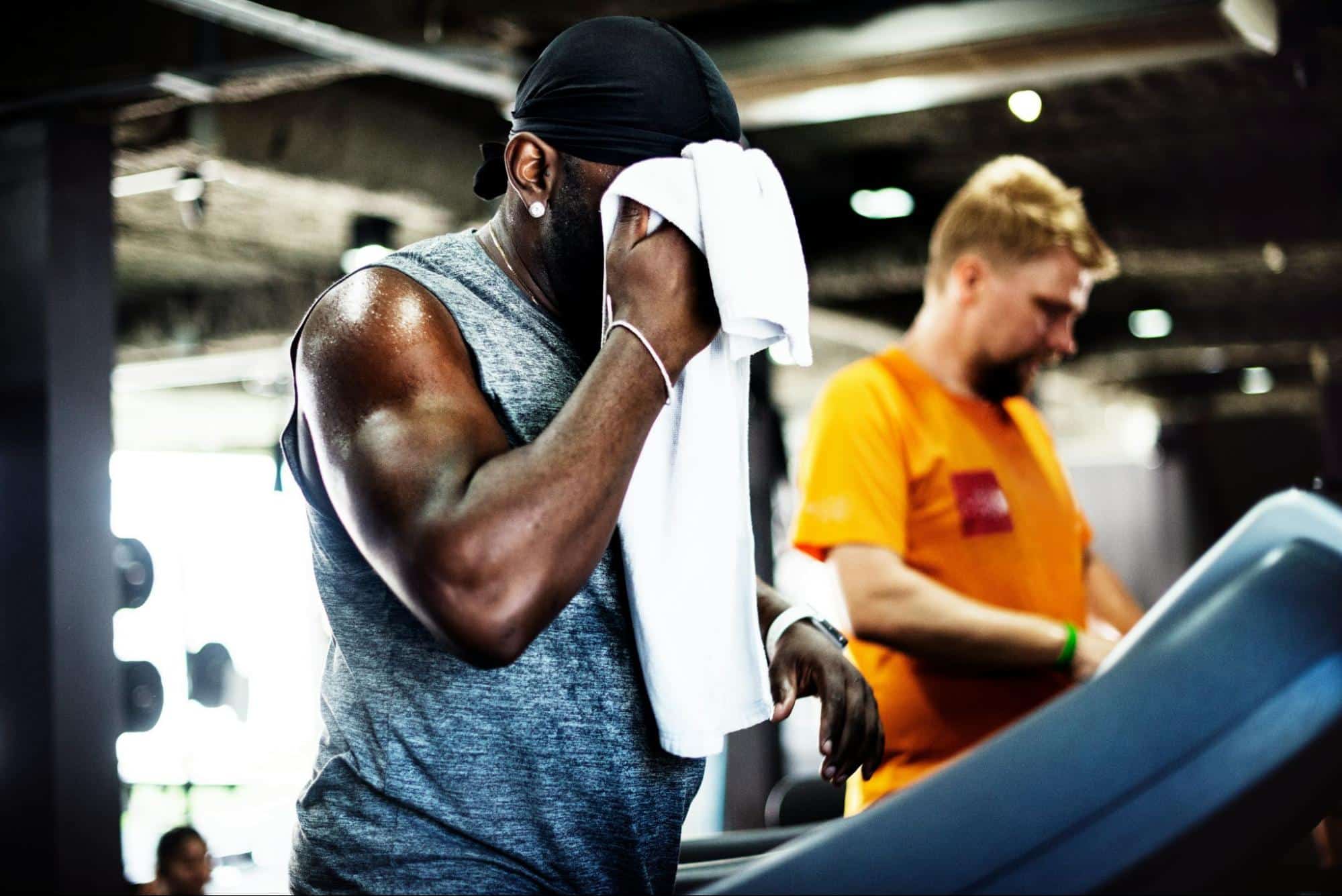 A man wiping his sweat.