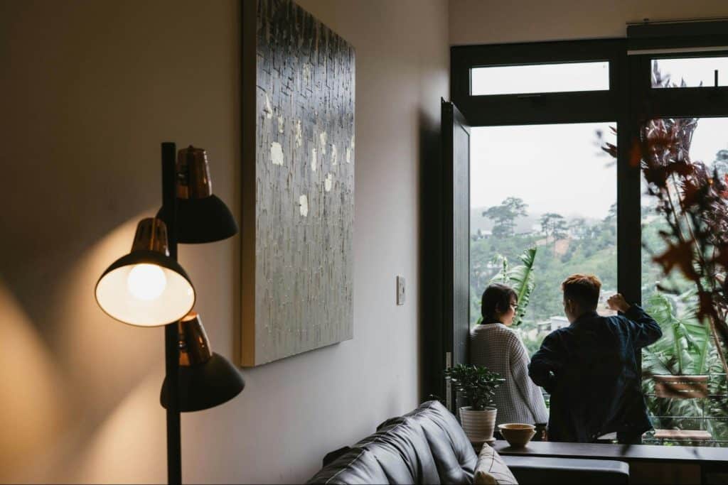 A man and woman sitting at the window