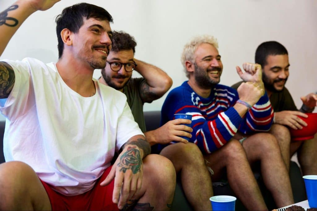 Men enjoying watching a movie.