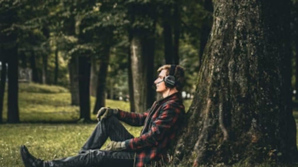 A man meditating outdoors before heading home