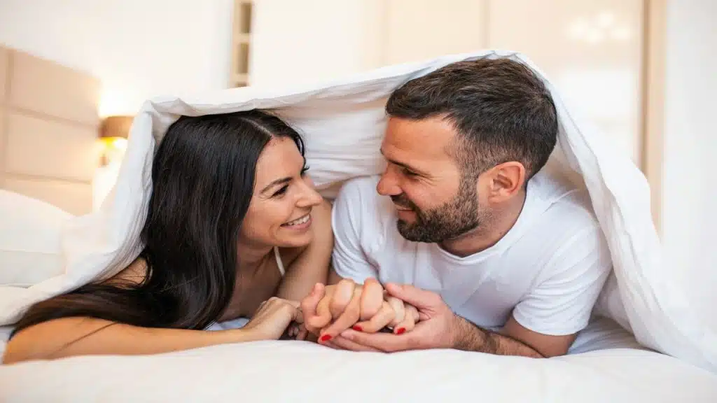A couple talking in bed