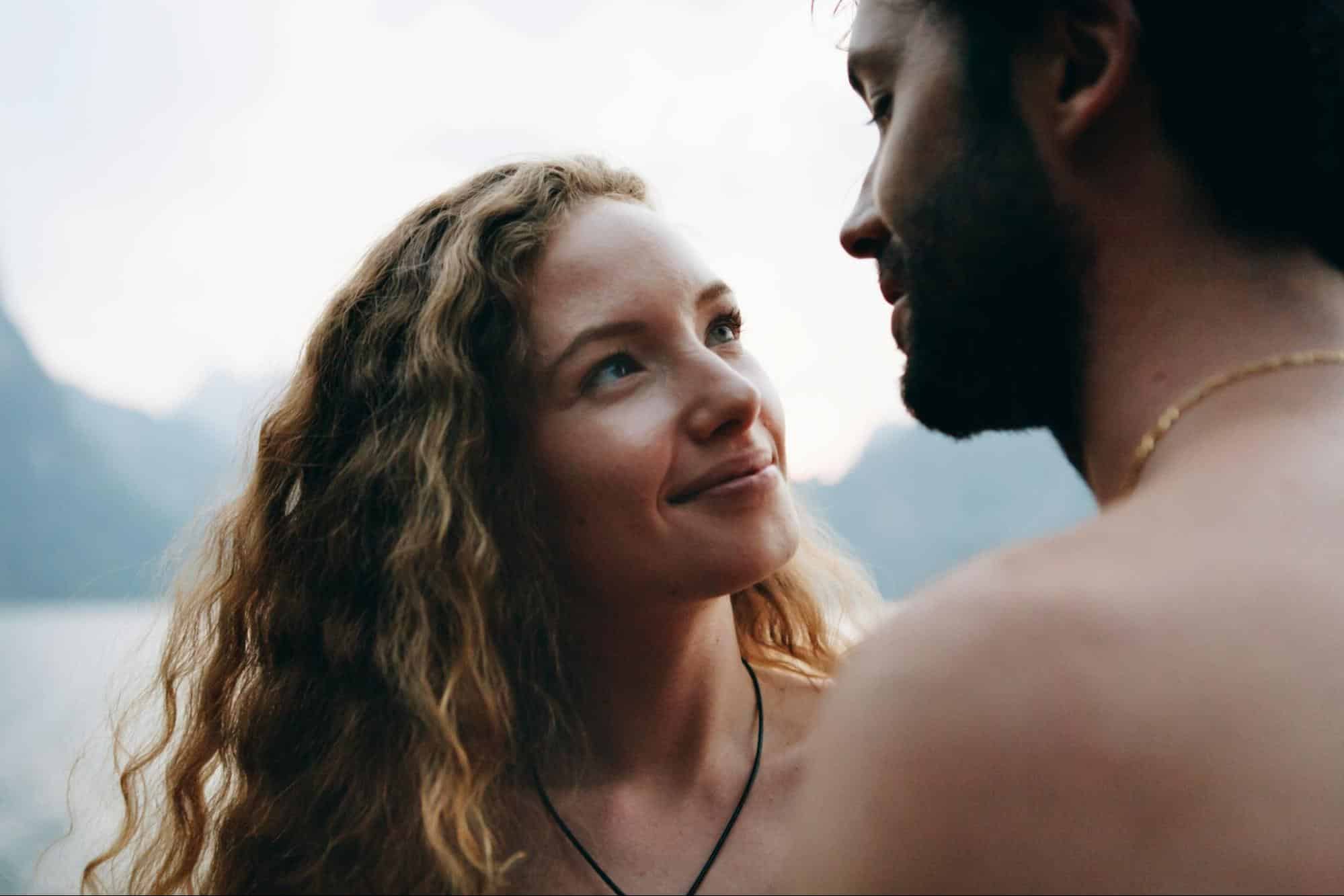 A woman looking at the man.