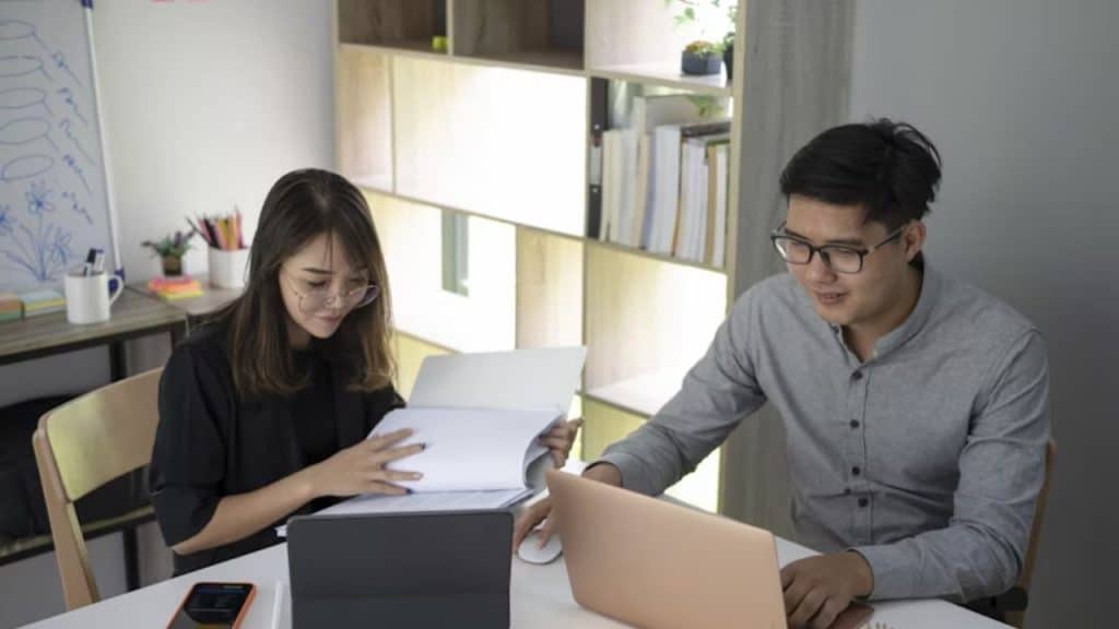Man and woman  creating a financial plan.