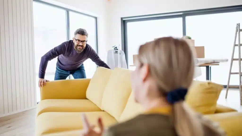 Man contributing to household tasks with his partner.