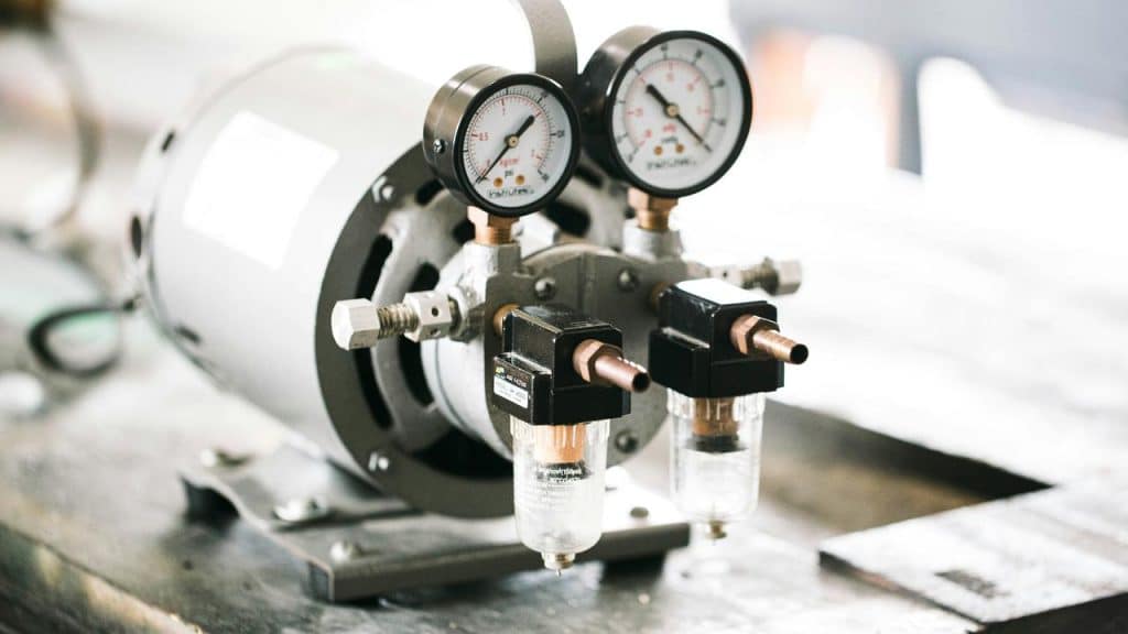 An air compressor showing its pressure gauge