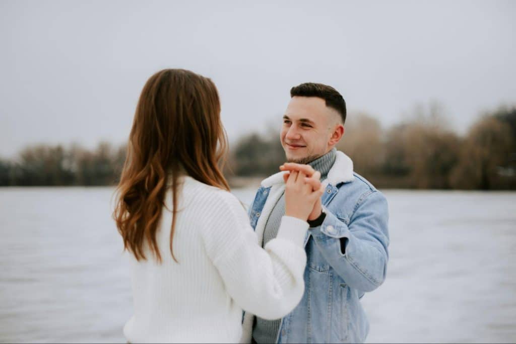 A woman saying sorry to a man