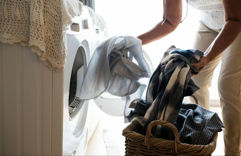 A man loading a laundry