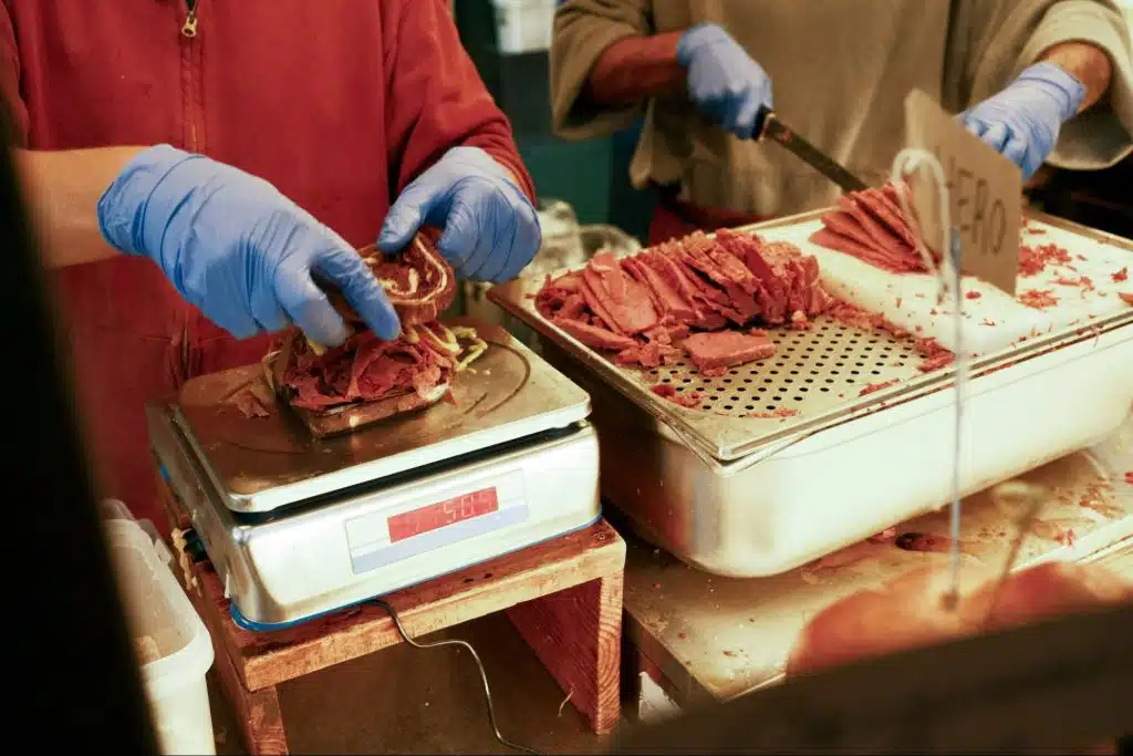 A man slicing meat 