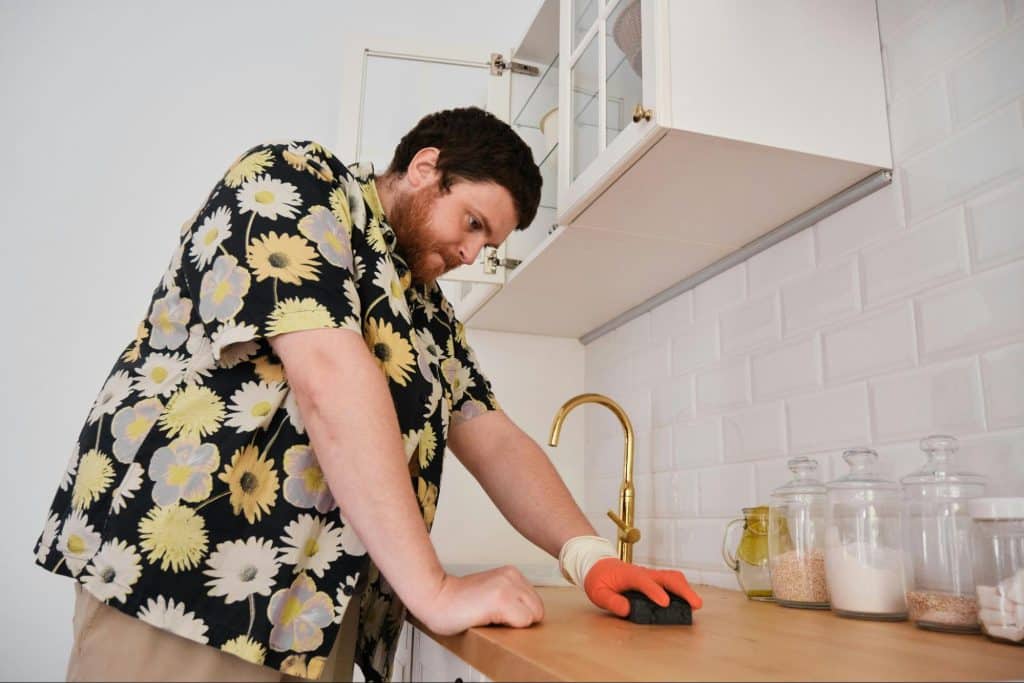A man cleaning dishes