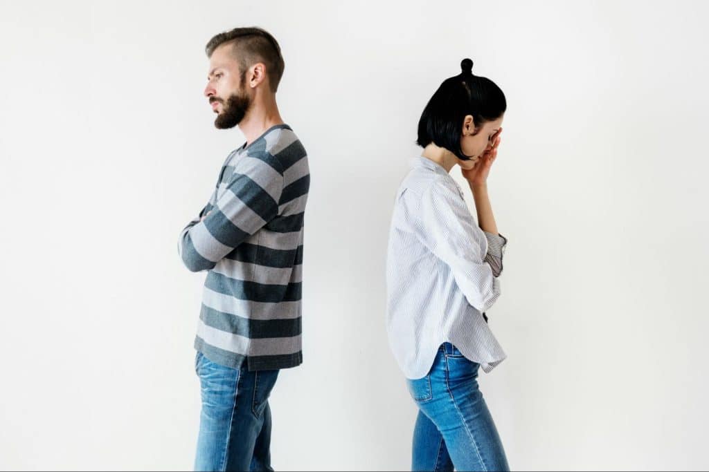A picture of couple facing away from each other