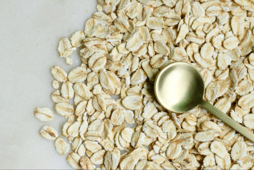 A picture of an oat with a spoon.