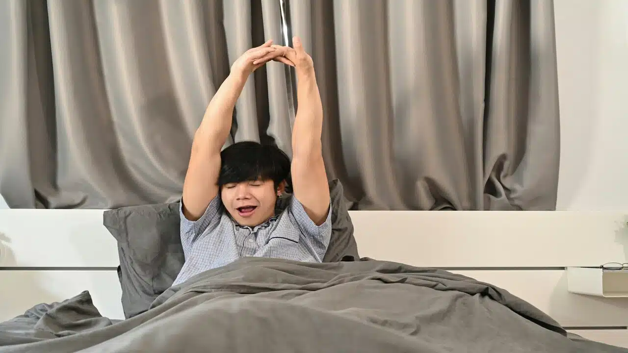 A man waking up in the morning.