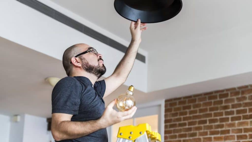 Man changing the flickering bulb  remembering small preferences