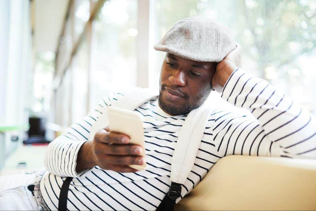 A man texting a woman