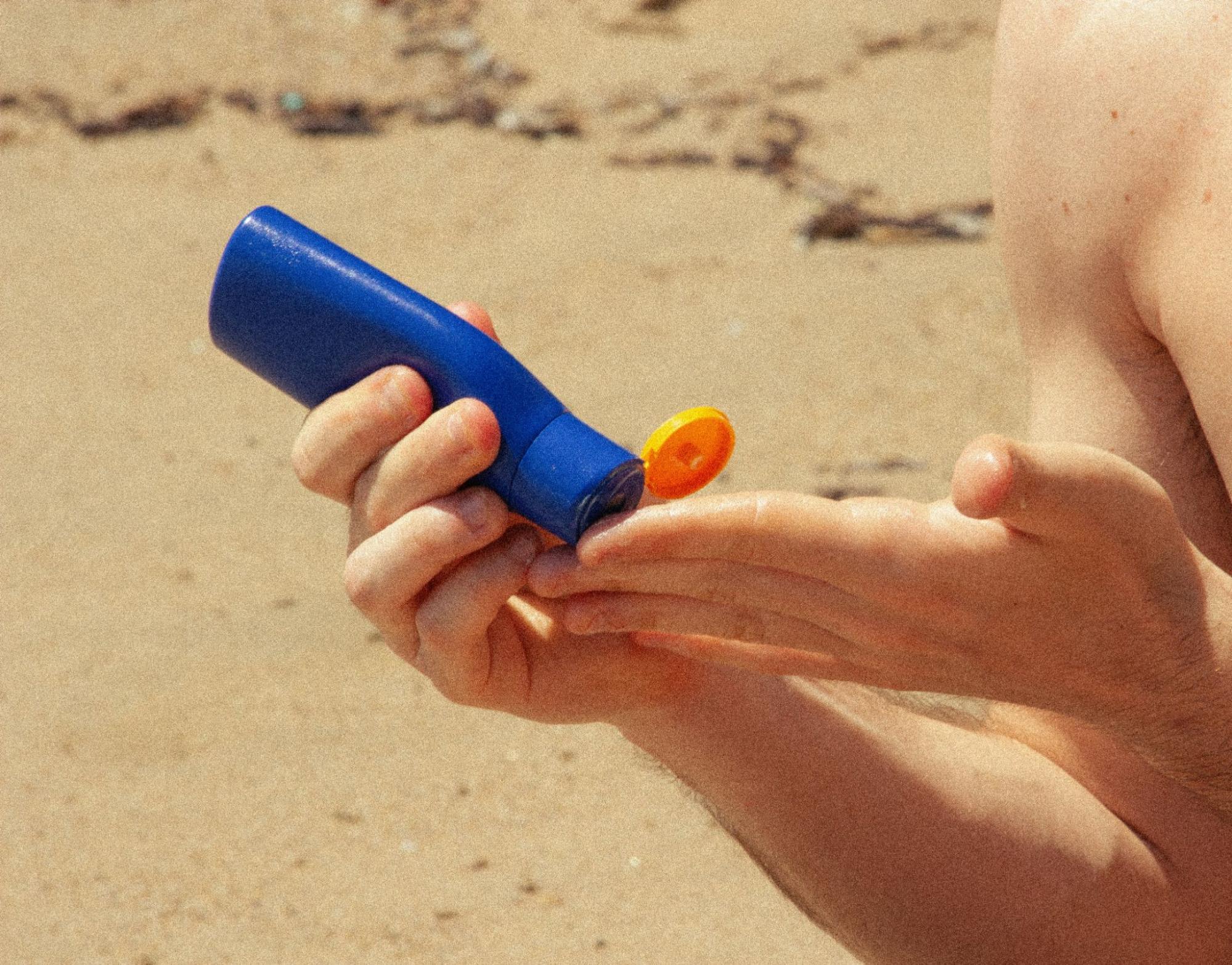 A man putting sunscreen.