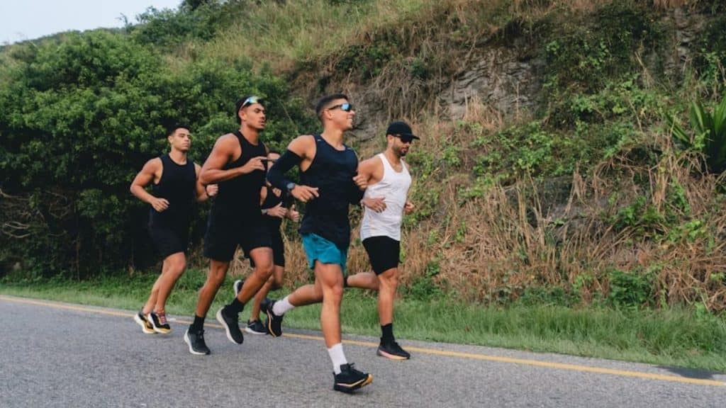 Group of men jogging together outdoors