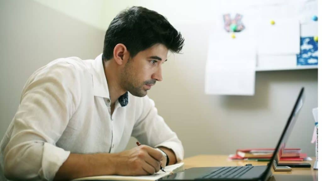 A man attending a personal growth discussion online