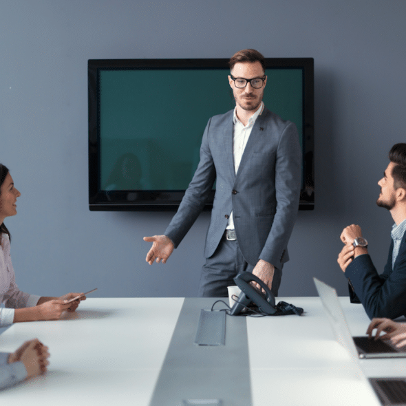 A man leading a business meeting