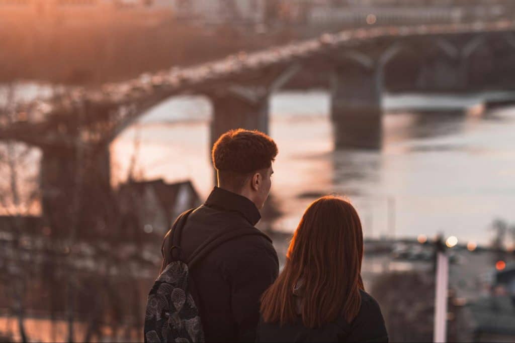 A man and woman watching a good view