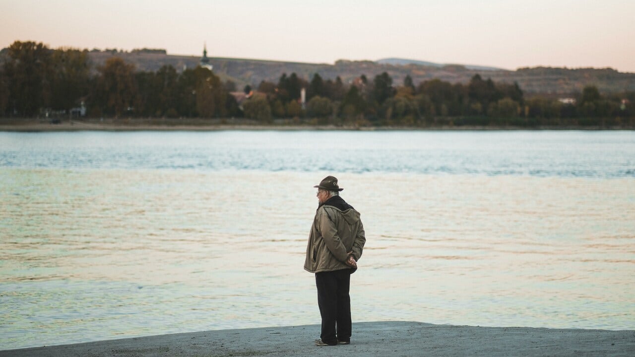 A man watching a body of water.