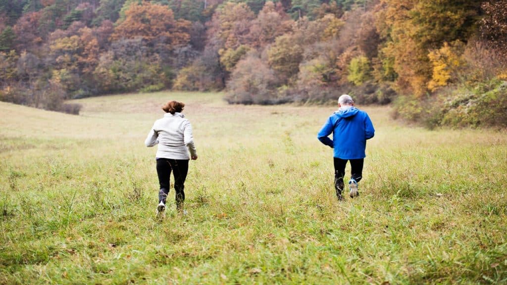 A mature couple jogging together