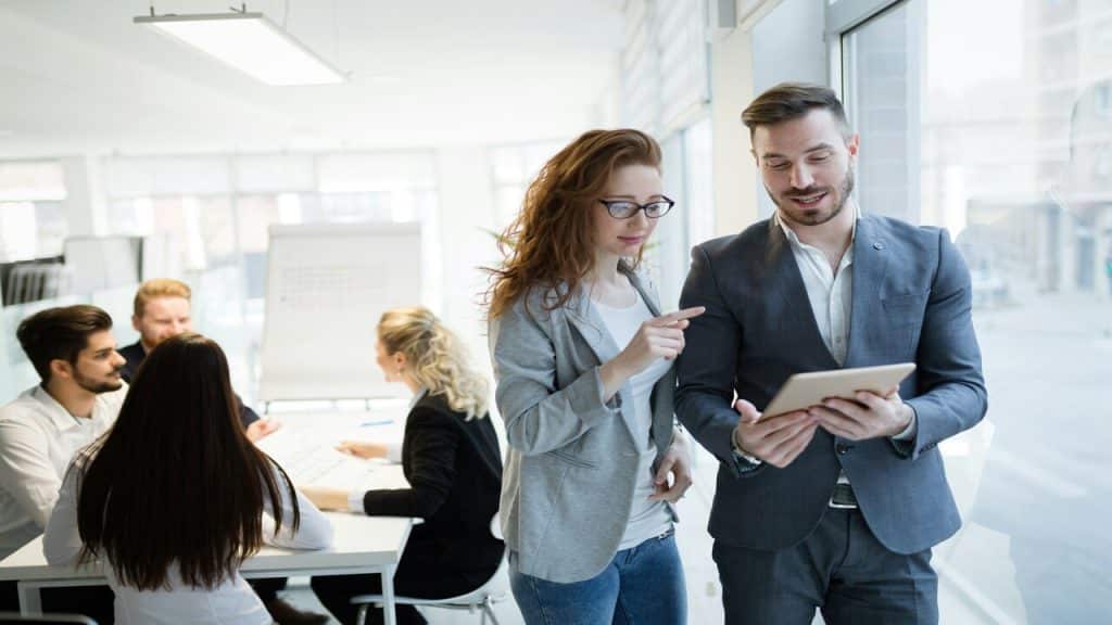Consultants talking at work