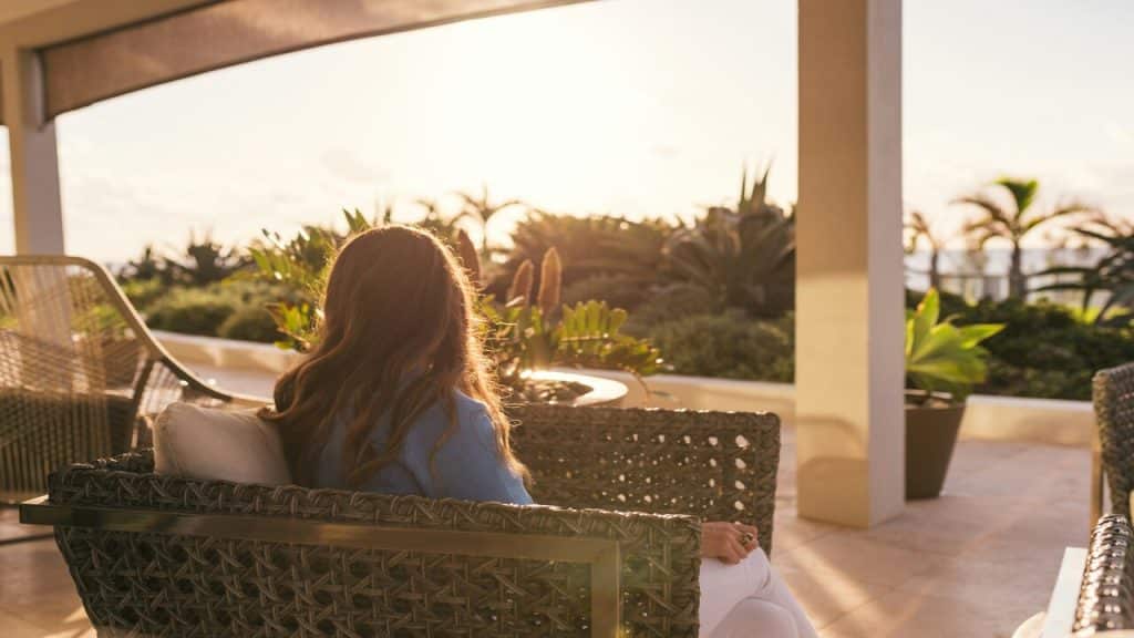 A woman sitting on the porch