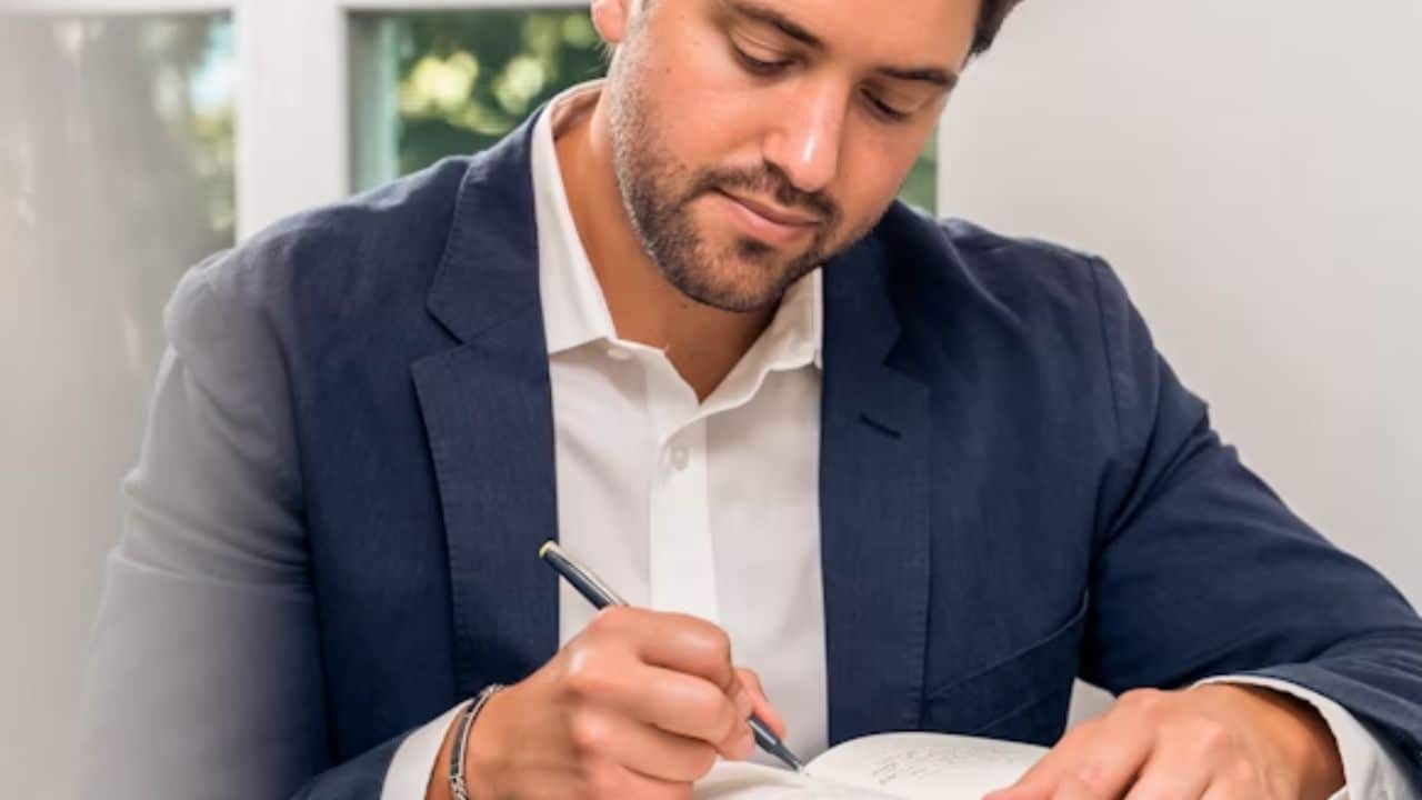 Man embracing an honest and personal healing journey through journaling.