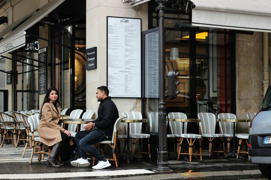 A man and woman sitting outside 