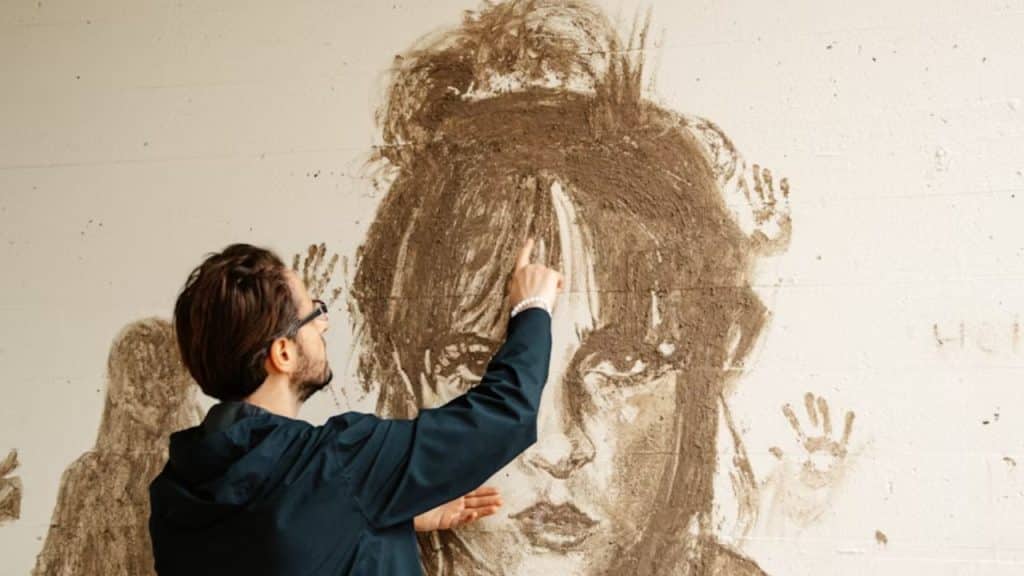 Man painting or sketching in a minimalist studio