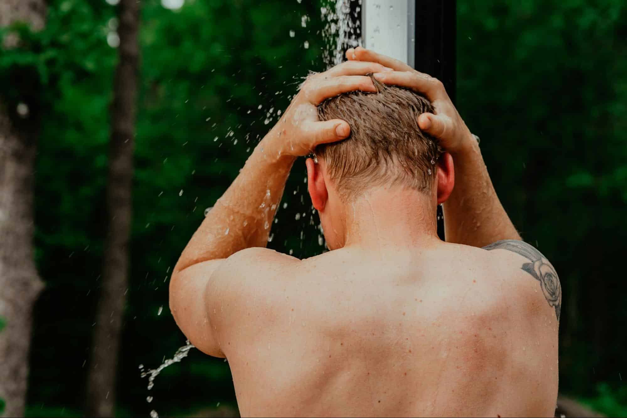 A man getting a quick shower.