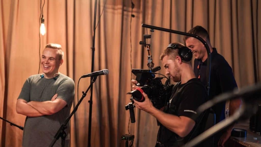 Group of men filming a movie