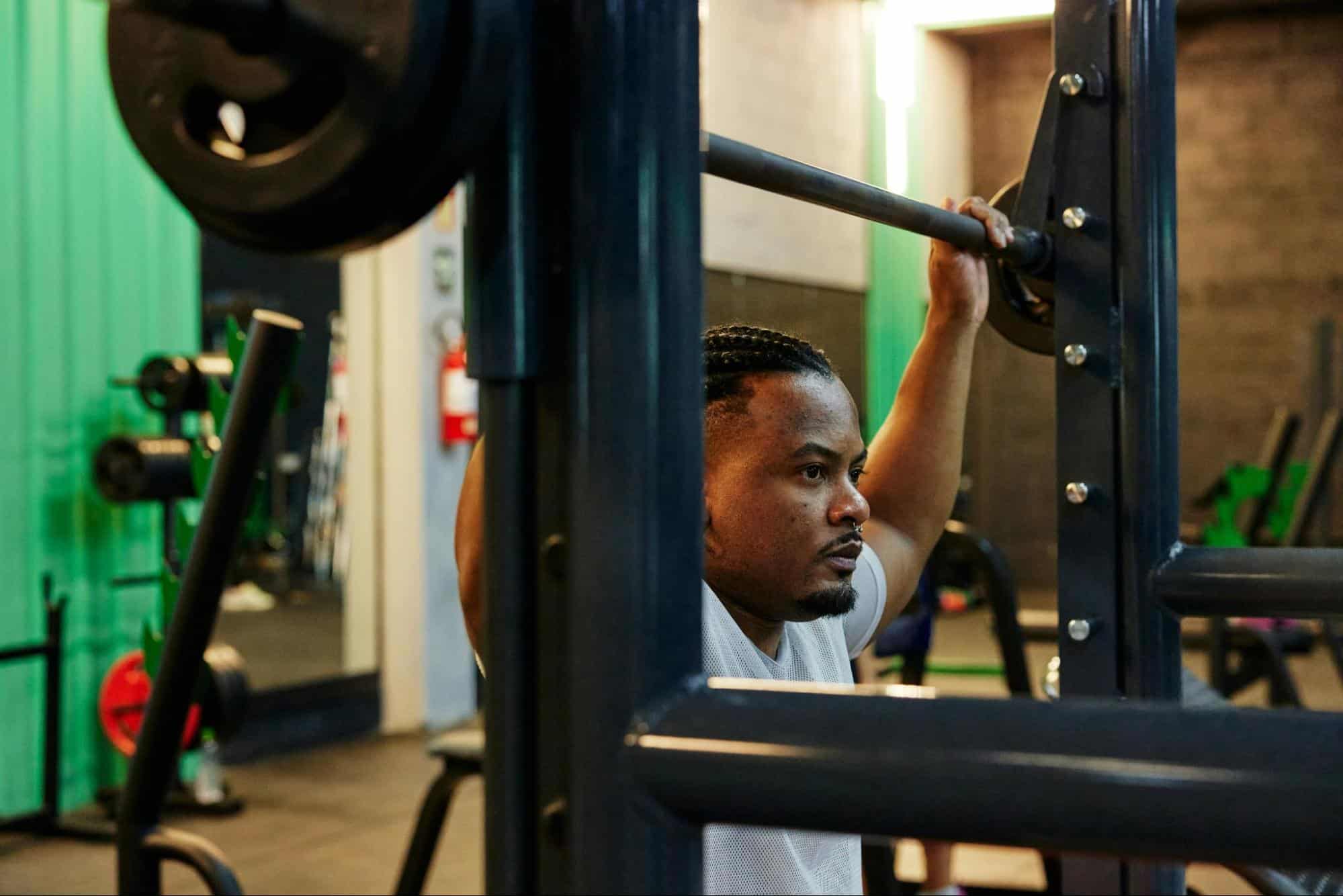 A man lifting a barbell.