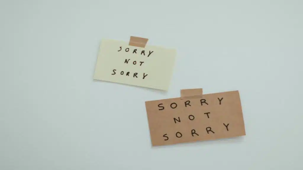 “Sorry not sorry” written on pieces of paper