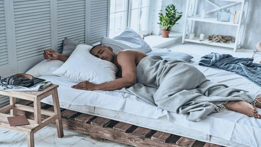 A man sleeping by himself at home