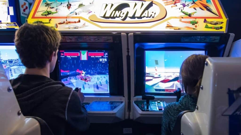 Couple at an arcade enjoying a date night for deeper connection.