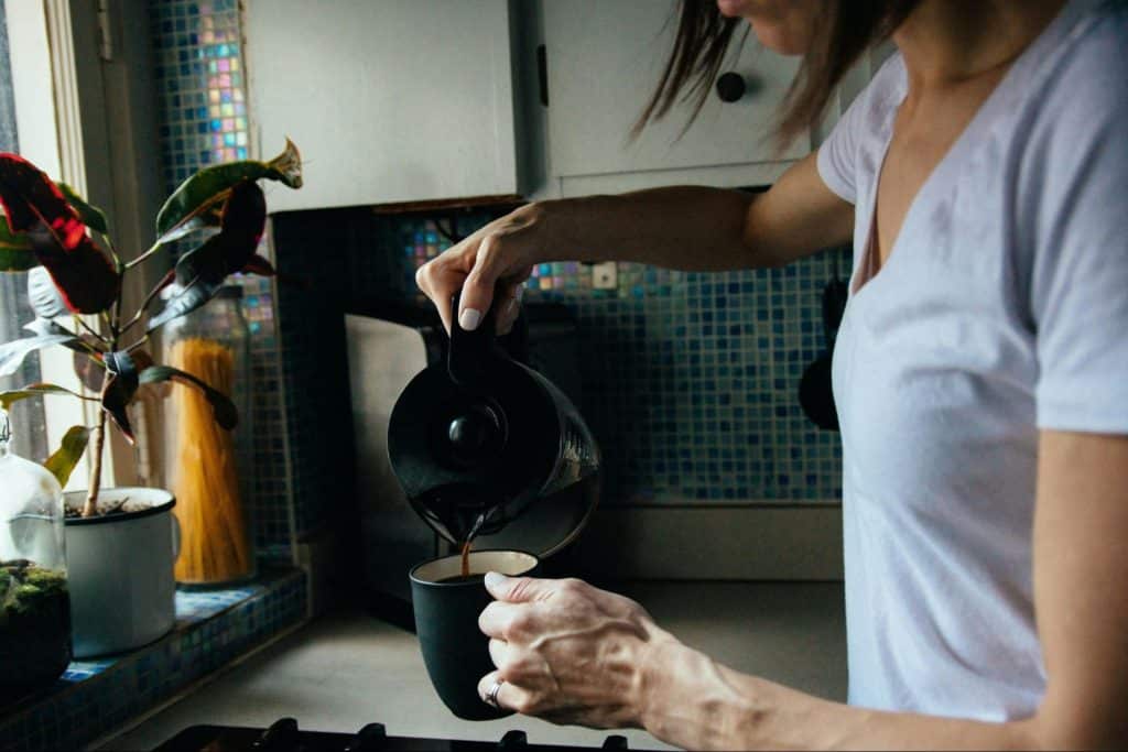 A woman making a brew coffee