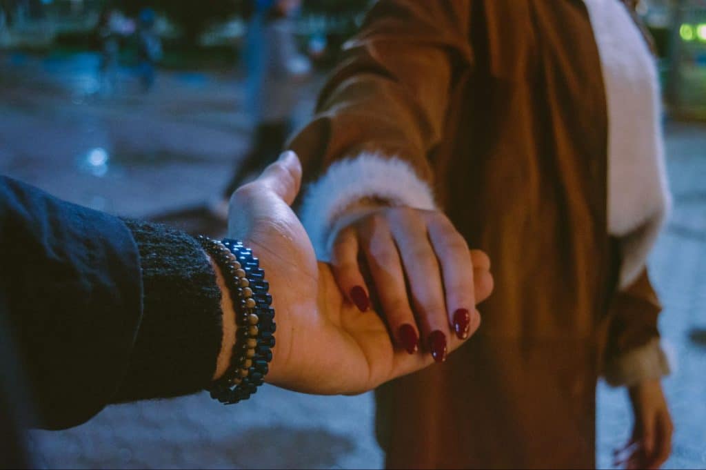 A man and woman holding hands