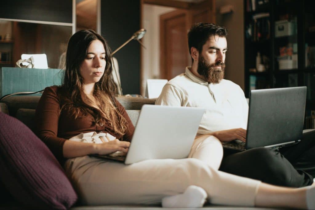 A man and woman doing work together