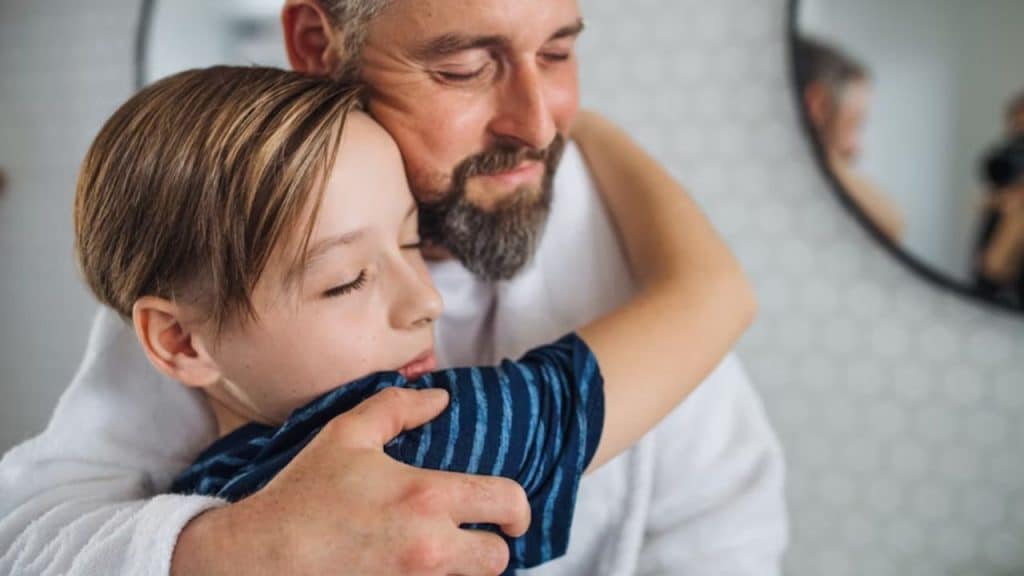Man expressing consistent love and care to his teenager