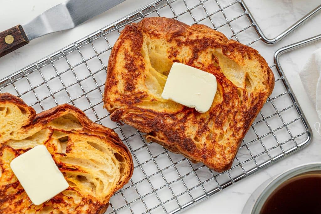 A picture of a butter on a bread