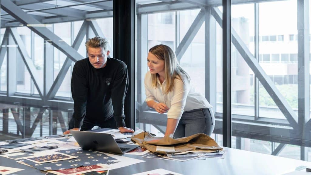 Colleagues helping each other at work