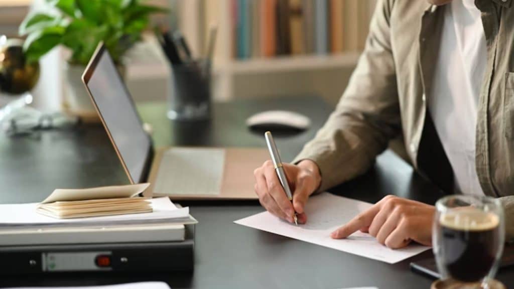 Man journaling showing emotional investment through personal growth