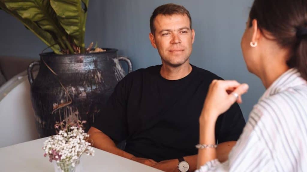 Man showing active listening skills during a conversation