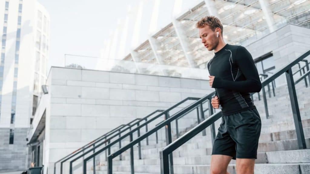 Confident and energetic man going up and down the stairs.