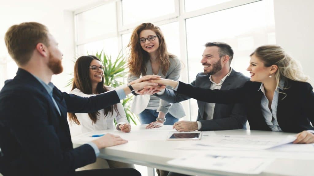 A group of colleagues on a team huddle