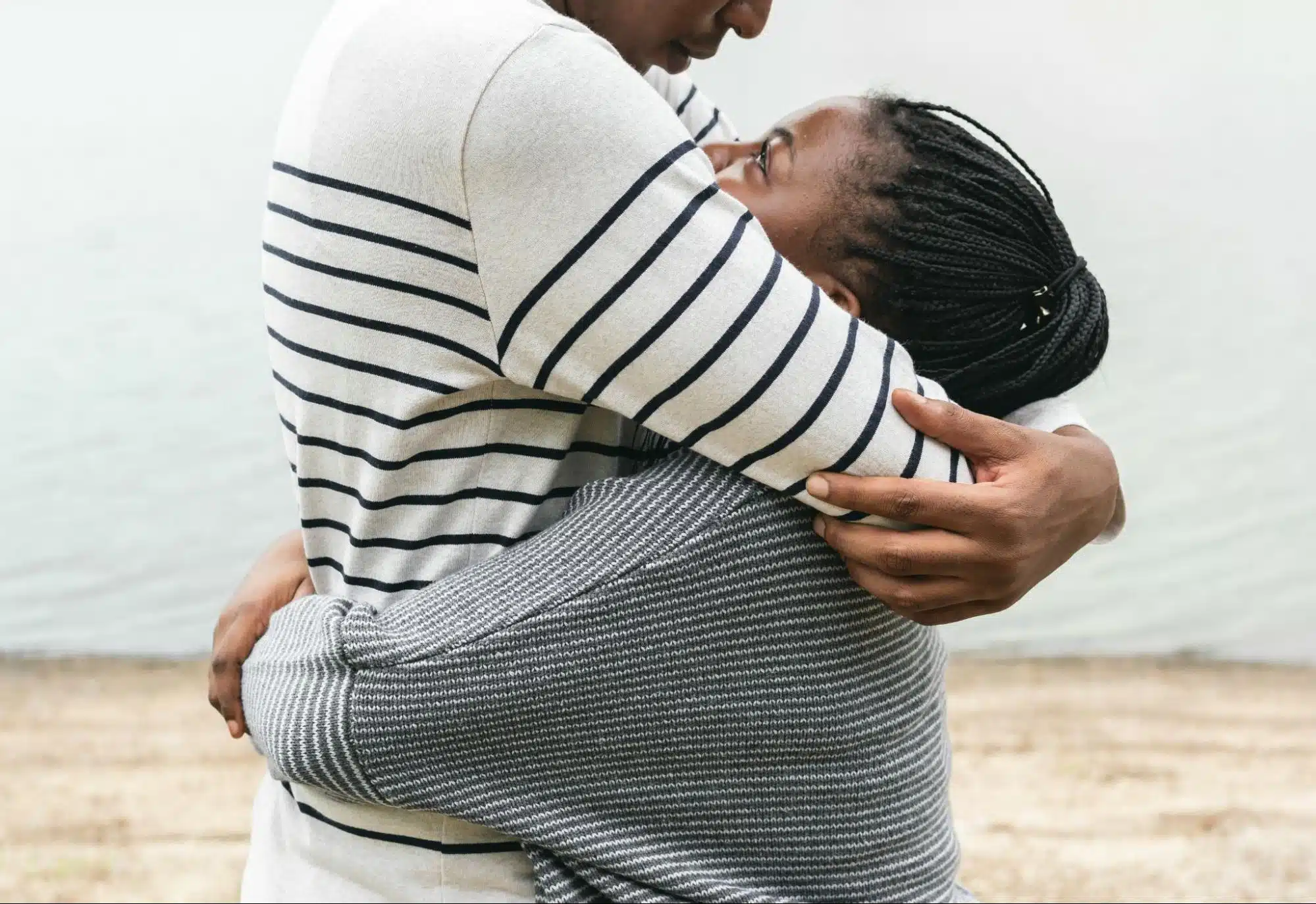 A woman hugging a man.