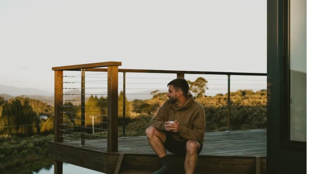 A man enjoying a quiet coffee alone at sunrise